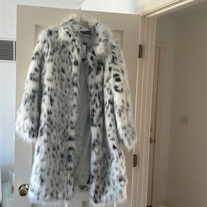 Beautiful faux fur coat made by Fhillinul.  White with black dots.  Length 36”